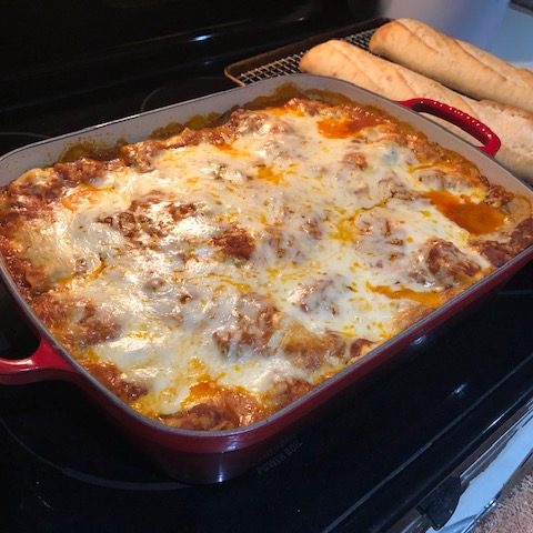 casserole dish of lasagna on stove top