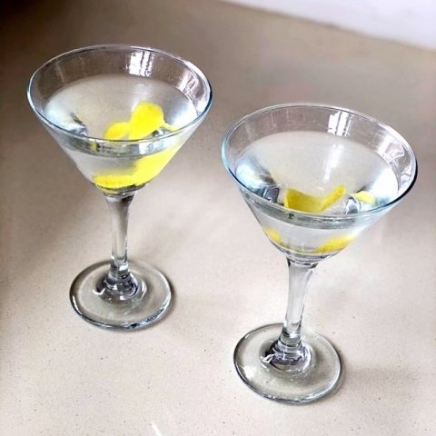 two vesper martinis on a counter