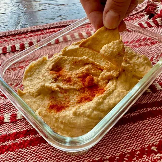 Serving roasted garlic hummus